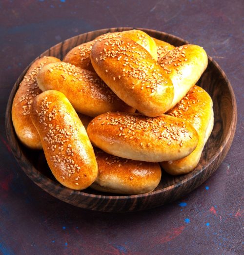 front view sweet patties delicious baked dough for tea on a dark background meal pastry tea food patty dough