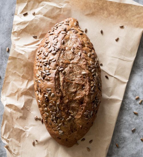 top-view-bread-with-seeds-parchment-paper